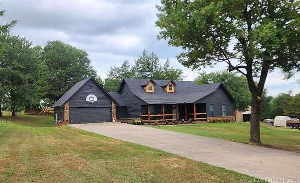 10.6 Acres of Land with Home for Sale in Howe, Oklahoma