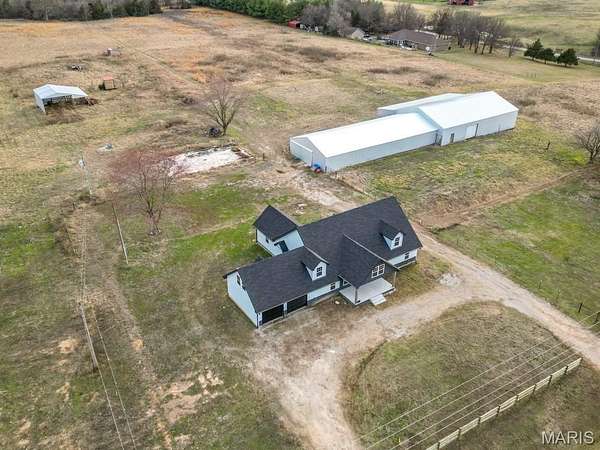 34 Acres of Agricultural Land with Home for Sale in Lebanon, Missouri