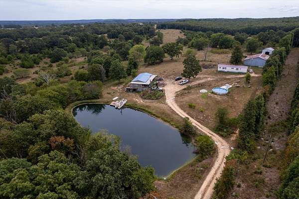 159 Acres of Land with Home for Sale in Grovespring, Missouri
