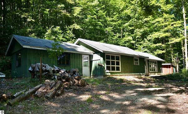 14 Acres of Recreational Land with Home for Sale in Cedar, Michigan