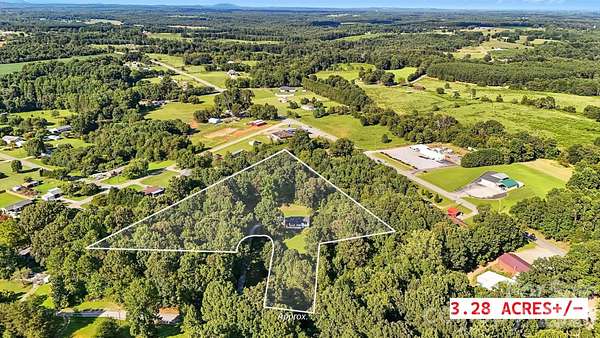 3.28 Acres of Land with Home for Sale in Lawndale, North Carolina