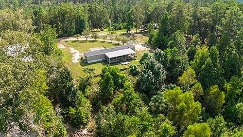 1.61 Acres of Land with Home for Sale in Brookeland, Texas
