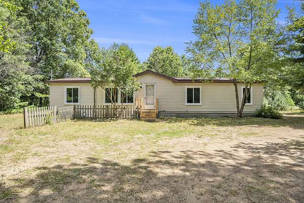 2.5 Acres of Residential Land with Home for Sale in Grant, Michigan