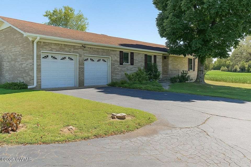 9.8 Acres of Residential Land with Home for Sale in Saltillo, Tennessee