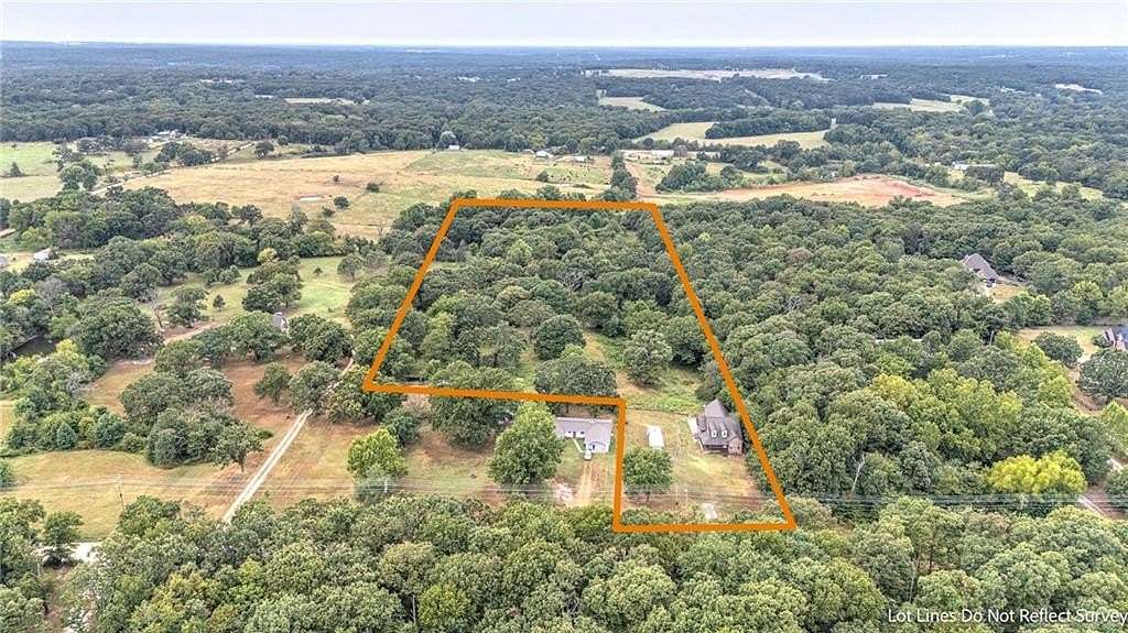 9.86 Acres of Land with Home for Sale in Gravette, Arkansas
