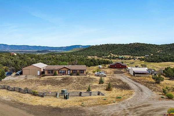 9 Acres of Residential Land with Home for Sale in Mancos, Colorado