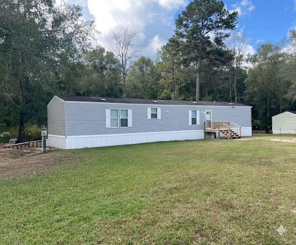 1.6 Acres of Residential Land with Home for Sale in Kountze, Texas