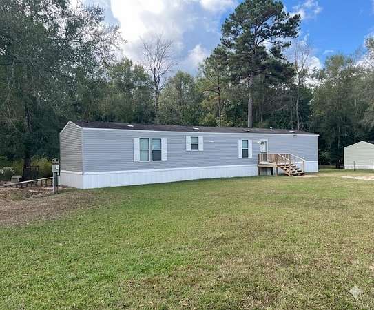 1.6 Acres of Residential Land with Home for Sale in Kountze, Texas