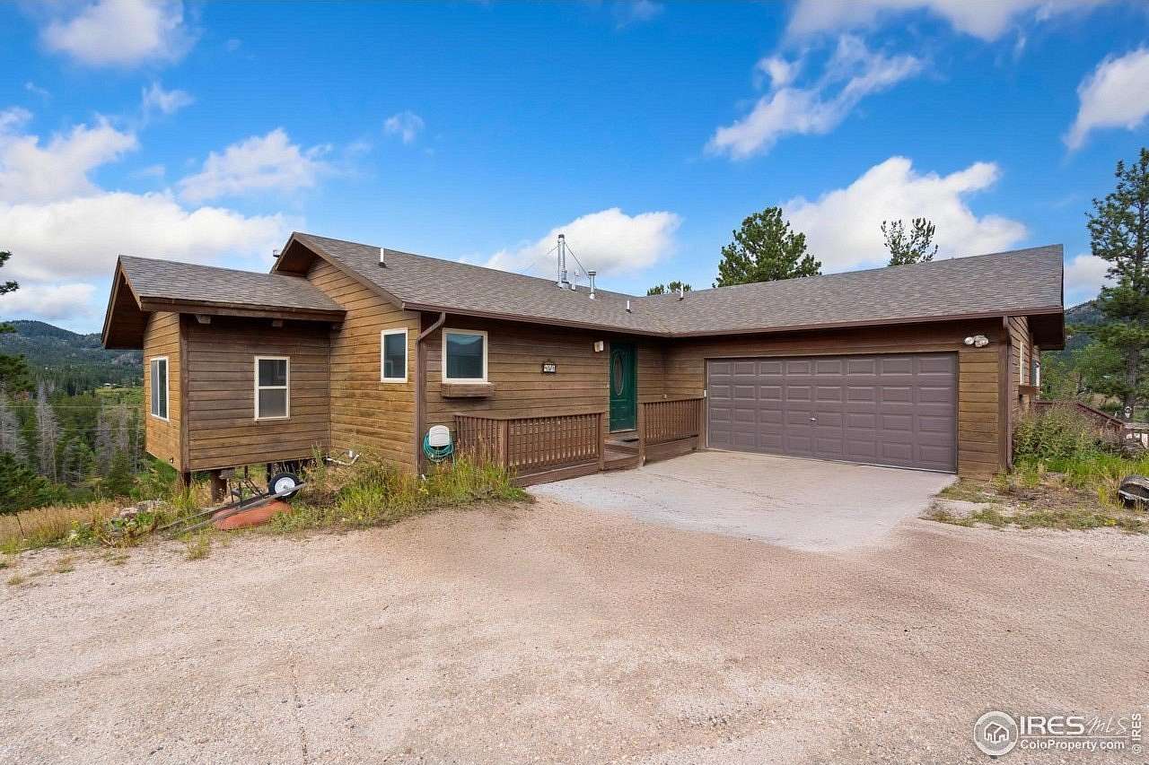 2.45 Acres of Residential Land with Home for Sale in Red Feather Lakes, Colorado