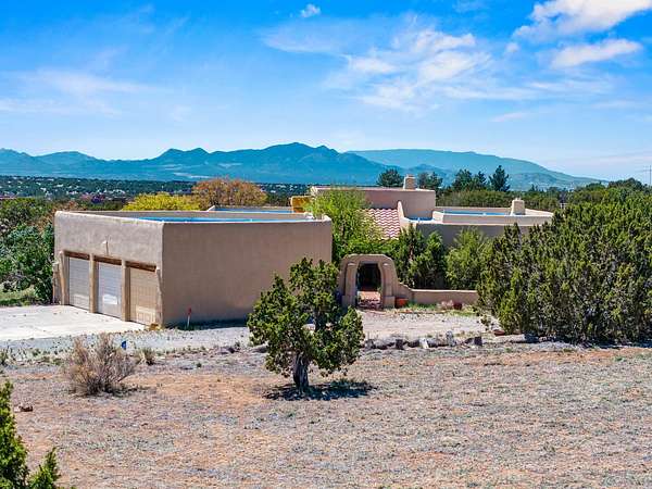 5 Acres of Residential Land with Home for Sale in Lamy, New Mexico