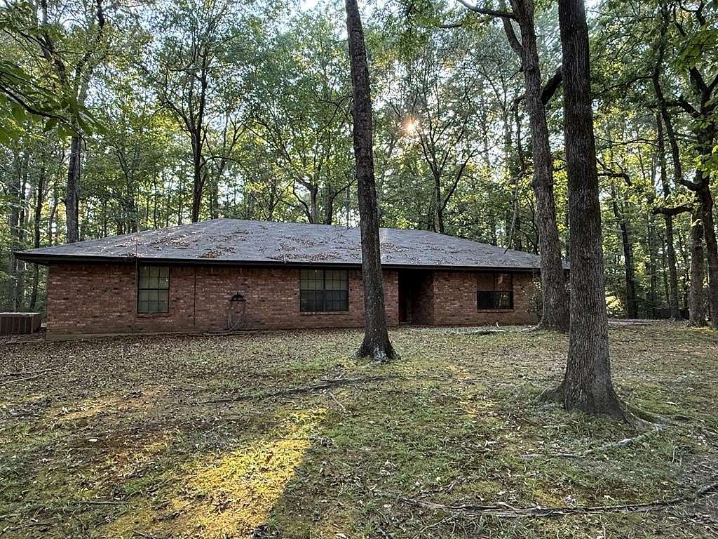 19.9 Acres of Recreational Land with Home for Sale in Shelbyville, Texas