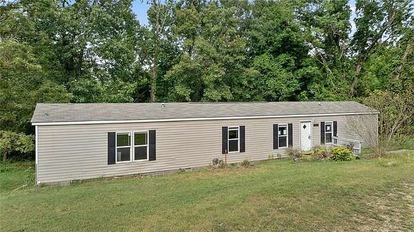 5 Acres of Residential Land with Home for Sale in Garfield, Arkansas