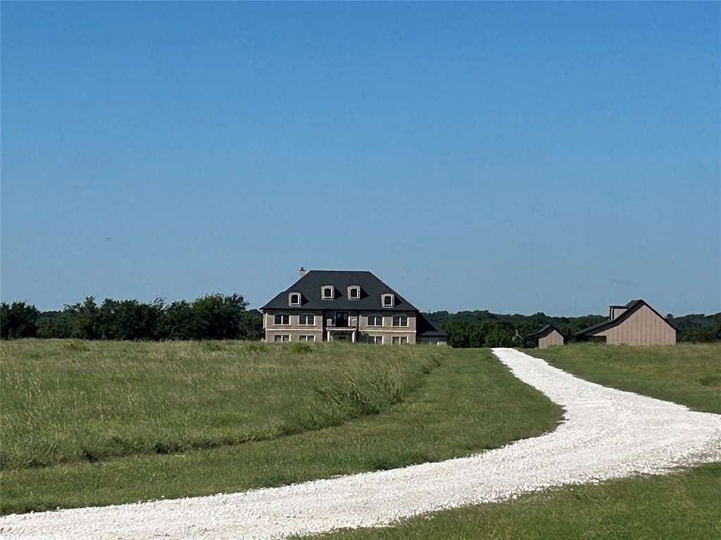 20 Acres of Agricultural Land with Home for Sale in Grandview, Texas