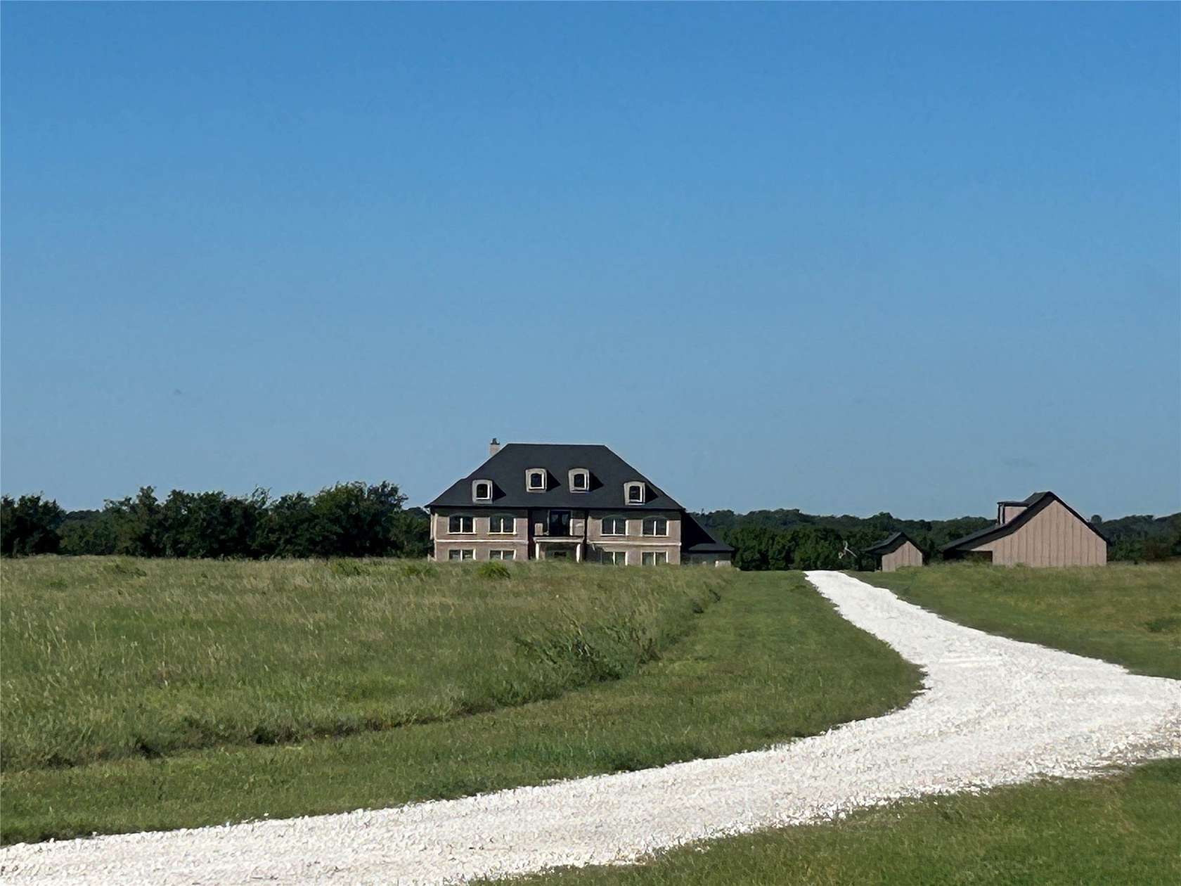20 Acres of Land with Home for Sale in Grandview, Texas