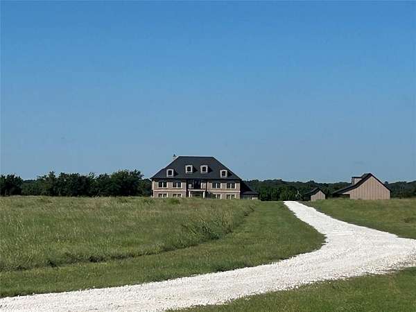 20 Acres of Agricultural Land with Home for Sale in Grandview, Texas