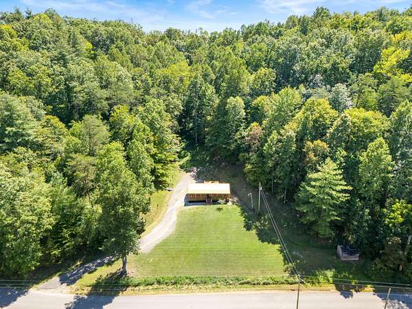 10.4 Acres of Land with Home for Sale in Campton, Kentucky