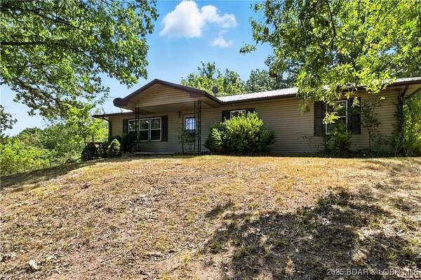 3 Acres of Residential Land with Home for Sale in Macks Creek, Missouri