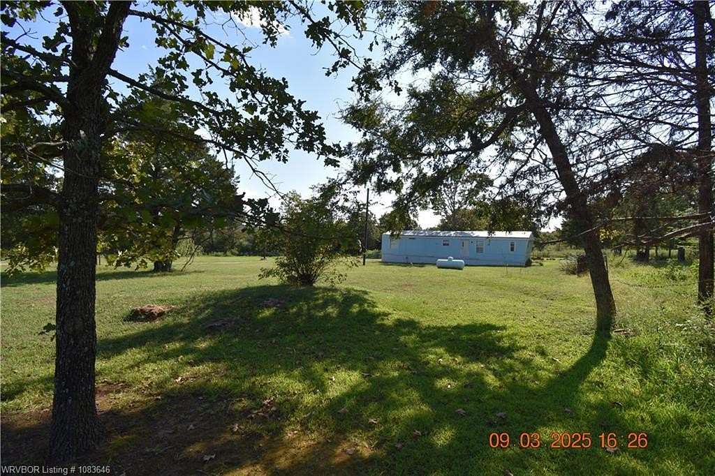6.64 Acres of Land with Home for Sale in Sallisaw, Oklahoma
