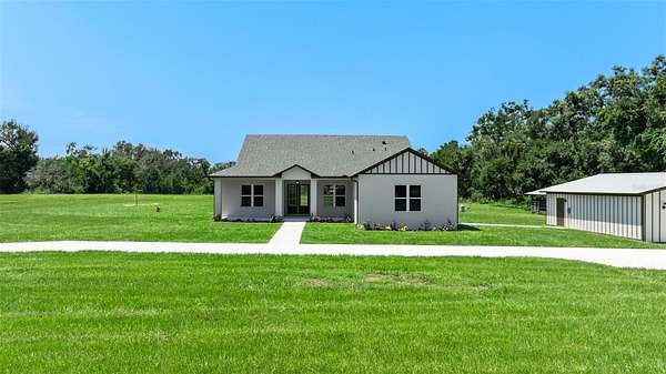 7.69 Acres of Land with Home for Sale in San Antonio, Florida