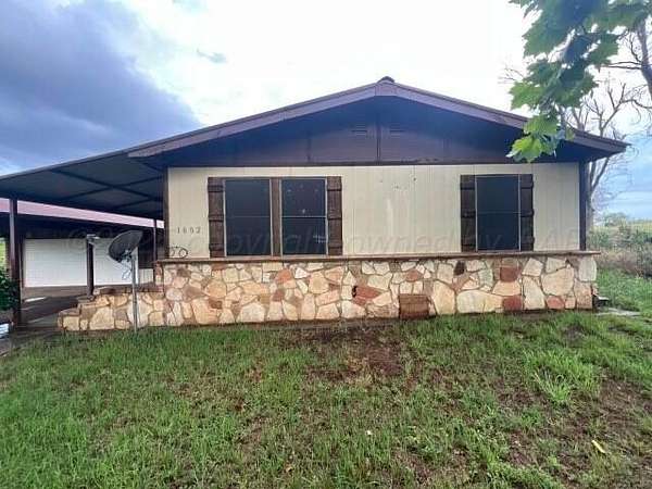 3.9 Acres of Residential Land with Home for Sale in Childress, Texas