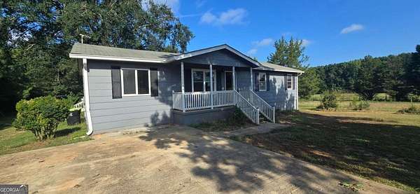 7.49 Acres of Residential Land with Home for Sale in Locust Grove, Georgia