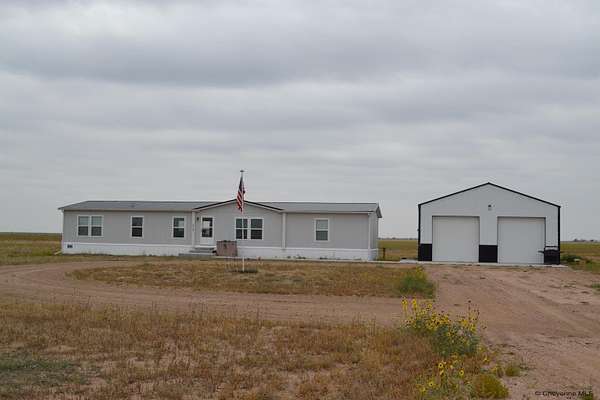 10.9 Acres of Land with Home for Sale in Carpenter, Wyoming