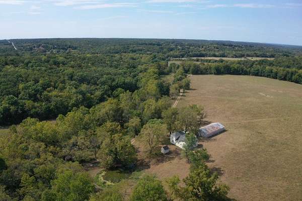 104 Acres of Agricultural Land with Home for Sale in Edwards, Missouri