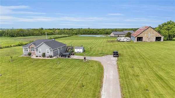 4.4 Acres of Residential Land with Home for Sale in Garden City, Missouri