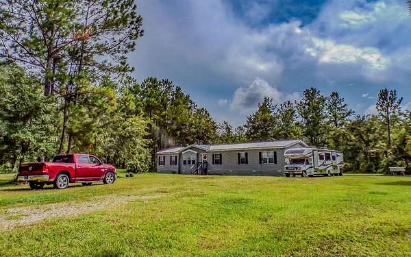 5 Acres of Residential Land with Home for Sale in Lake City, Florida