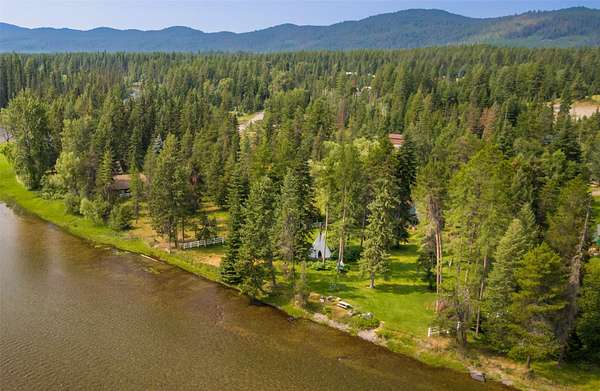 5.73 Acres of Residential Land with Home for Sale in Bigfork, Montana