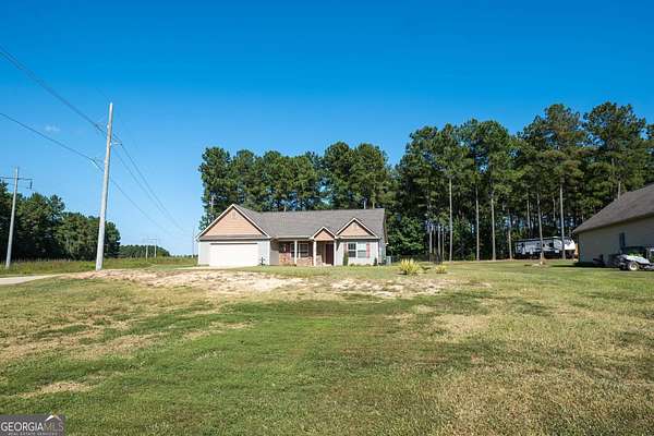 1.74 Acres of Residential Land with Home for Sale in Barnesville, Georgia