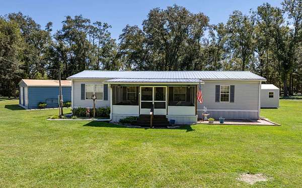 5 Acres of Residential Land with Home for Sale in Live Oak, Florida