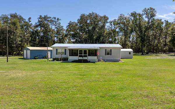 5 Acres of Residential Land with Home for Sale in Live Oak, Florida