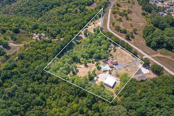 9.4 Acres of Residential Land with Home for Sale in Reeds Spring, Missouri