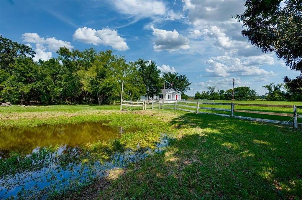 12.3 Acres of Recreational Land with Home for Sale in Arthur City, Texas