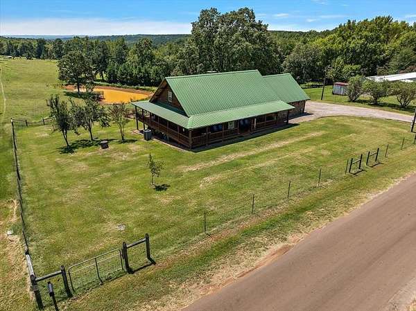 10 Acres of Residential Land with Home for Sale in Cushing, Texas