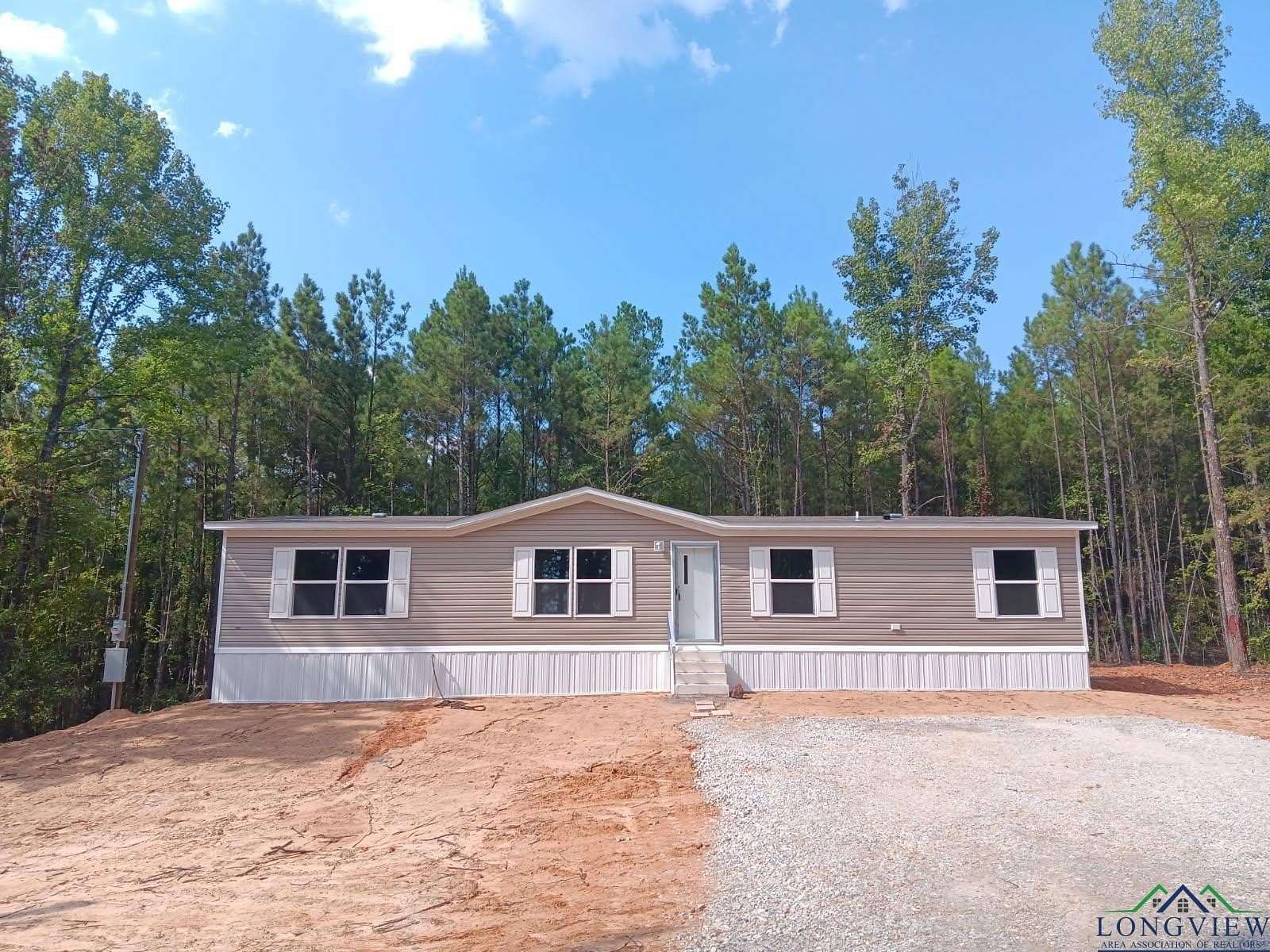 1.5 Acres of Residential Land with Home for Sale in Gilmer, Texas