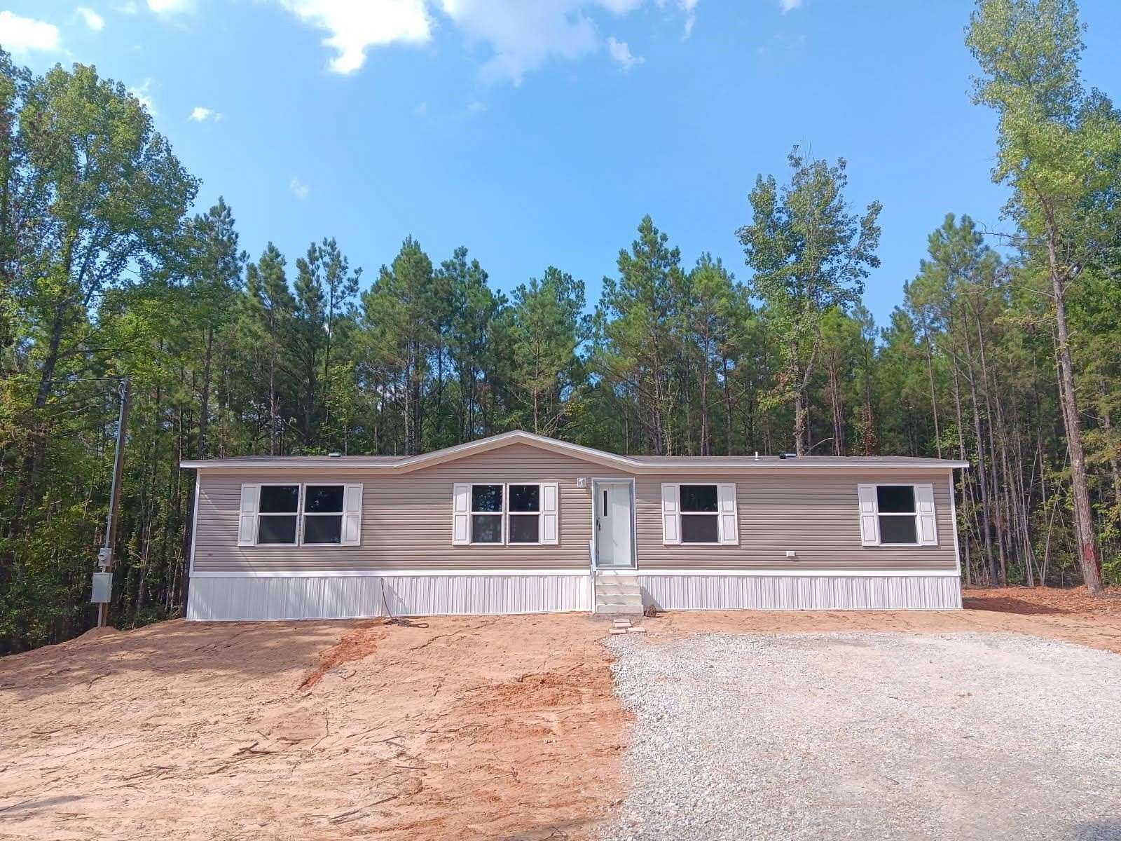 1.5 Acres of Land with Home for Sale in Gilmer, Texas