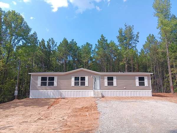 1.5 Acres of Land with Home for Sale in Gilmer, Texas