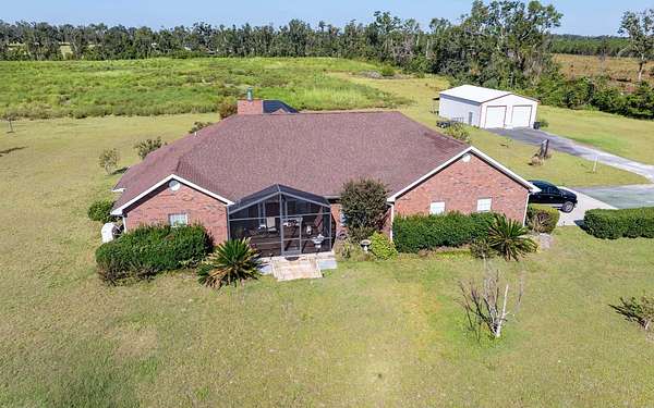 20.2 Acres of Agricultural Land with Home for Sale in Lee, Florida