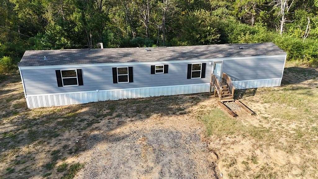 7 Acres of Residential Land with Home for Sale in Sardis, Mississippi