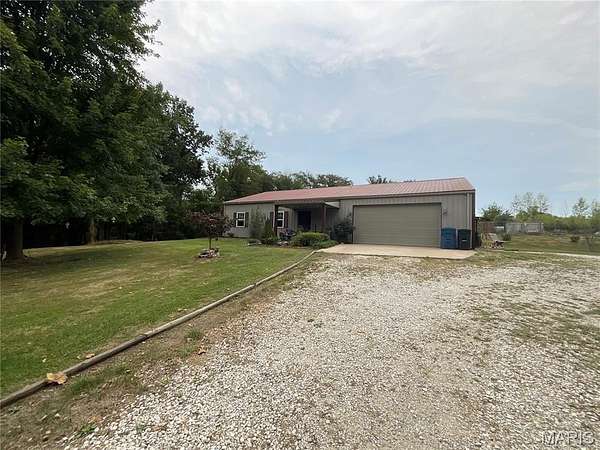 5 Acres of Residential Land with Home for Sale in Taylor, Missouri