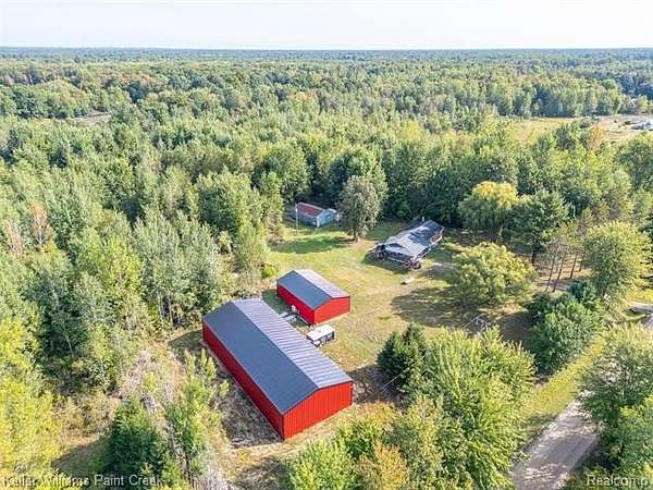 21 Acres of Recreational Land with Home for Sale in Beaverton Township, Michigan