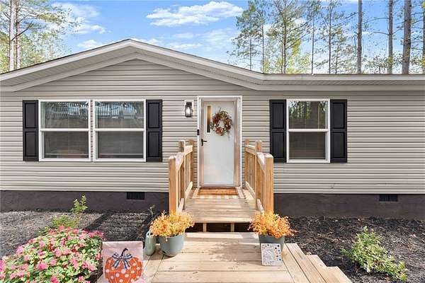 1.5 Acres of Residential Land with Home for Sale in Ball Ground, Georgia