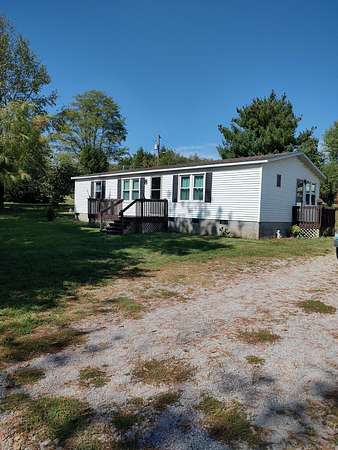 5 Acres of Residential Land with Home for Sale in Paris, Kentucky