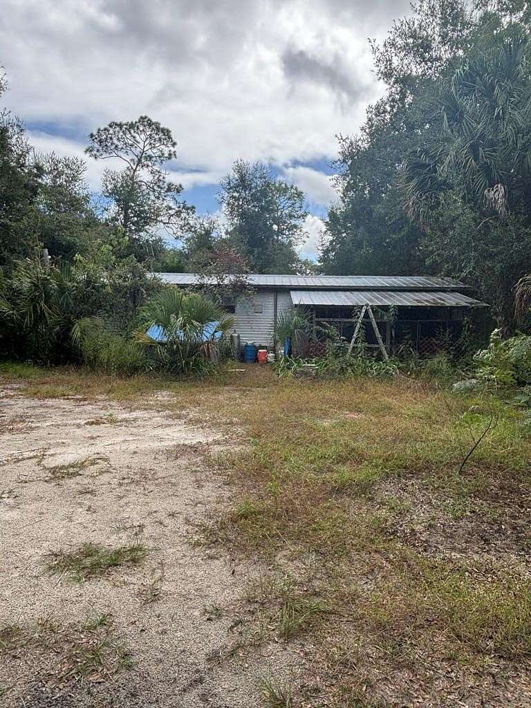5 Acres of Land with Home for Sale in Inglis, Florida