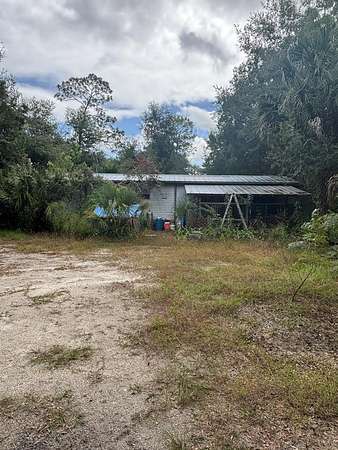 5 Acres of Land with Home for Sale in Inglis, Florida