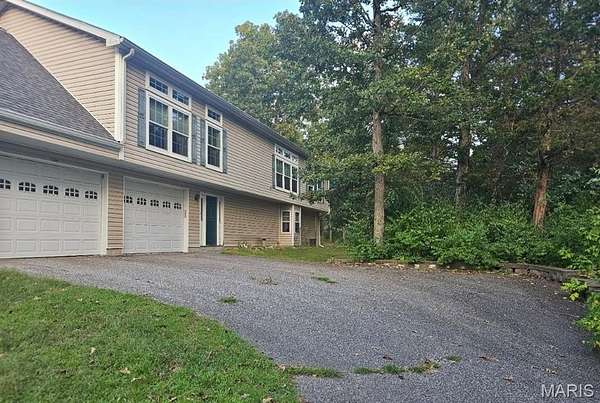 11.7 Acres of Land with Home for Sale in Catawissa, Missouri