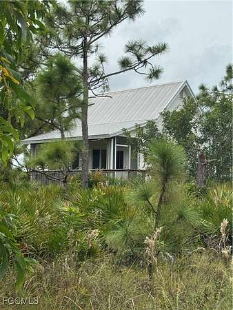 0.53 Acres of Residential Land with Home for Sale in Bokeelia, Florida