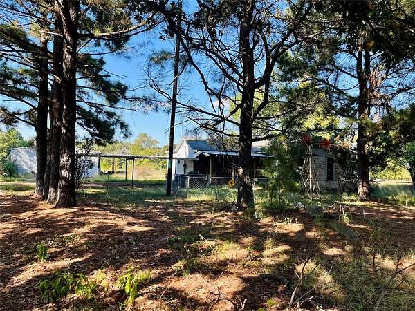 7.78 Acres of Residential Land with Home for Sale in Powderly, Texas